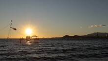 View Of Cable Ski In The Sea At The Coast Of Benidorm With A Beautiful Sunset In The Background