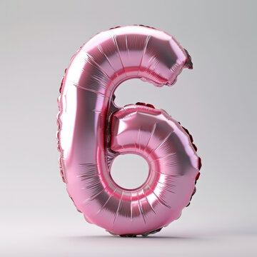 A pink foil balloon shaped like the number six