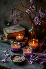  Spa, purple salts and lit candle with lilac flowers