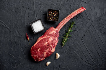 Wall Mural - raw Steak 
Tomahawk on stone background 