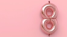 Celebration For International Women's Day. Number 8 Shaped Balloon On A Pastel Pink Background.