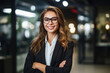 © PHB Stock - Smiling strong businesswoman on office workplace view background