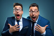 © Pierre - Two lookalike businessmen showing excitement in funny manner.