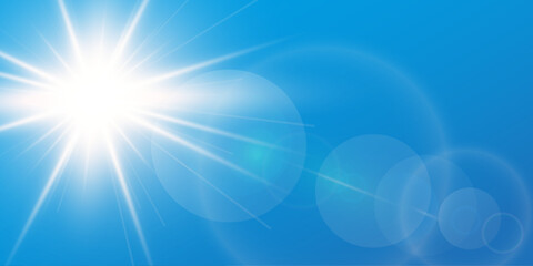 blue sky background with bright sun and lens flare