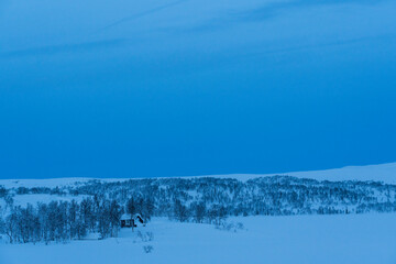 Wall Mural - The blue hour in the Norwegian winter mountain landscape