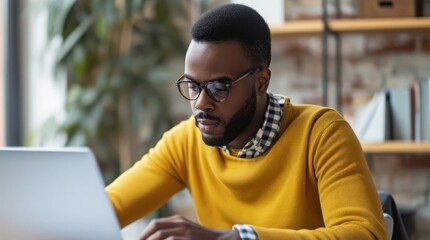 Poster - Black Man Sitting at Table Using Laptop Computer for Video Generative AI