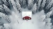 aerial shot of a small house in a winter forest with snow