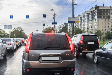 Wall Mural - car traffic in the city in the rain