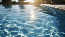Blue Water Surface With Bright Sun Light Reflections Water In Swimming Pool Background