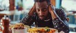 African-American man experiencing eating disorder and depression, lacking appetite.