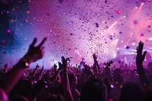 The Vibrant Magenta And Violet Confetti Raining Down On The Ecstatic Crowd At The Concert Created A Mesmerizing Purple Haze, Elevating The Already Electric Atmosphere Of The Rave-like Event
