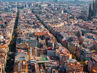 Wall Mural - Aerial view of Barcelona City Skyline and Sagrada Familia Cathedral at sunset. Residential famous urban grid of Catalonia. Beautiful panorama of Barcelona.