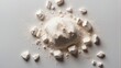 short shot of a mountain of white dust on a flat background
