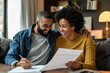 © senyumanmu - Man and woman couple smiling confident reading document at home