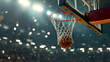 A basket ball flies into the basket against the background of a basketball arena