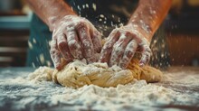  A Close Up Of A Person Kneading Dough On Top Of A Floured Surface With Their Hands On Top Of A Pile Of Uncooked Uncooked Dough.