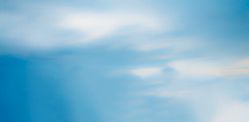 Wall Mural - blue cyan blurry sky background with light clouds