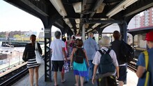 Back Of People Going To Brighton Beach In NYC, United States