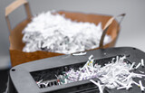 Fototapeta  - Ścinki papieru z niszczarki, zniszczone dokumenty firmowe w biurze