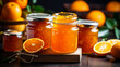 orange jam in a glass jar. orange jam on a wooden background. Delicious natural marmalade
