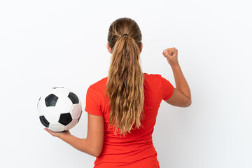 Wall Mural - Little caucasian girl isolated on white background with soccer ball