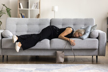 Full-length View Tired Mature Woman Felt Asleep On Sofa, Arrive At Home After Party Or Hard-working Day, Flopped Down On Couch Looks Squeezed Like Lemon, Need Rest For Restoring. Overwork, Exhaustion