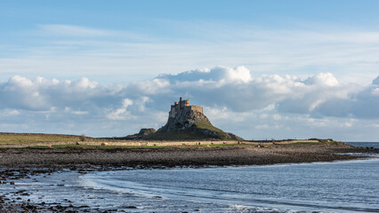 Wall Mural - Stunning dramatic landscape image of Lindisfarne, Holy Island in Northumberland England during Winter