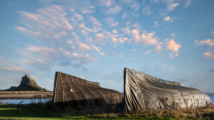 Wall Mural - Stunning dramatic landscape image of Lindisfarne, Holy Island in Northumberland England during Winter