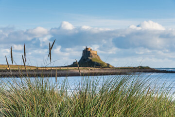 Wall Mural - Stunning dramatic landscape image of Lindisfarne, Holy Island in Northumberland England during Winter