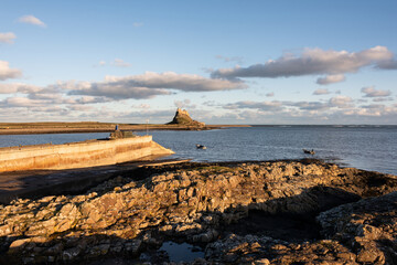 Wall Mural - Stunning dramatic landscape image of Lindisfarne, Holy Island in Northumberland England during Winter