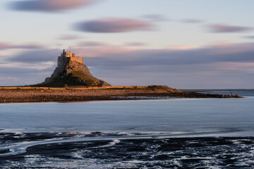 Wall Mural - Stunning dramatic landscape image of Lindisfarne, Holy Island in Northumberland England during Winter