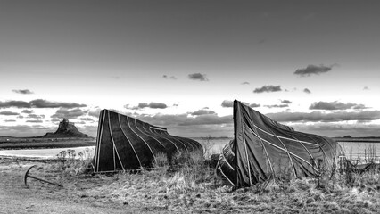 Wall Mural - Stunning  black and white dramatic landscape image of Lindisfarne, Holy Island in Northumberland England during Winter