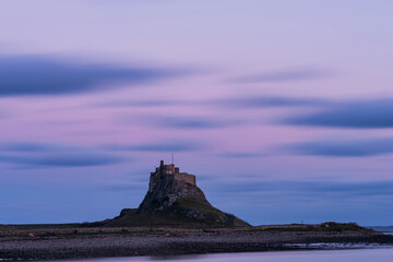 Wall Mural - Stunning dramatic landscape image of Lindisfarne, Holy Island in Northumberland England during Winter