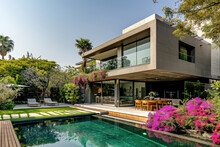 A Modern Minimalist House With A Big Flowers Garden And A Pool