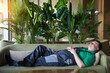 © ALEXEY - Rest after lunch Siesta in European countries, the worker sleeps on the sofa during the day.