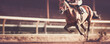 © Bonsales - Jockey on racehorse galloping race in sandy hippodrome on competition
