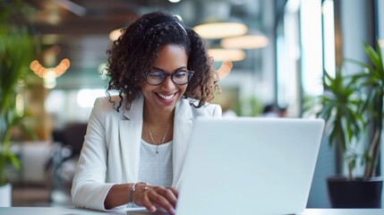 Poster - Busy and smiling mix race businesswoman typing on laptop, office worker with glasses happy with achievement results, at work inside office building 