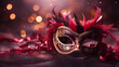 Venice Festival - Venetian carnival mask on red glitter with shiny streamers on abstract defocused bokeh lights