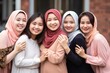 Young Muslim women work team standing in different colorful headscarves smiling in modern office