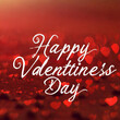 Happy Valentines Day Handwriting Text In Abstract Defocused Red Background