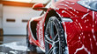 Professional Car Wash Red Sportscar with Shampoo close-up