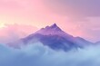 mountains covered in mist under a beautiful pink sky