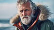 portrait of experienced strong man from the far north with an icy beard, confidently and seriously looking straight