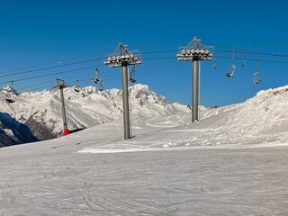 Wall Mural - ski lift in beautiful snowy mountains in a ski resort in Tarentaise france