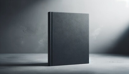 Aufkleber - Black book with spotlight on textured concrete surface. Dramatic lighting. Generative AI