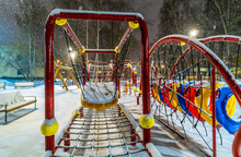 Children's Playground On A Winter Evening In The Park.
