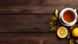 cup of black tea and lemons on wooden table top view