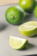 sliced limes on a gray