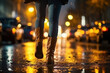 Close-up view, low angle, female legs are walking through the wet night city.