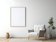 © tanjidvect - Living room with chair and blank white frame mockup on the wall